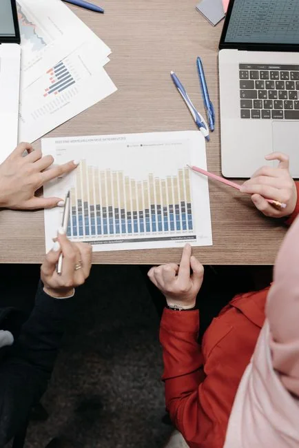 Man analyzing marketing content strategies using sticky notes on a whiteboard.